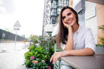 Poster - Photo of peaceful gorgeous lady sit coffee shop table waiting order daydreaming imagine free time outside