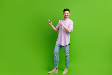 Sticker - Full length photo of nice glad man dressed stylish clothes demonstrate empty space isolated on green color background