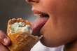 Teenage boy eating snacks close-up. Snack, sweets, street food. Intermediate meal. Mouth with teeth, tongue and saliva