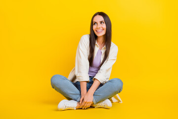 Sticker - Full length photo of gorgeous positive minded person sit floor look empty space ad isolated on yellow color background