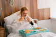 A girl in hospital ward eats healthy food brought to her by the staff for her recovery and recuperation
