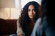 young mixed race woman talking to professional psychotherapist 