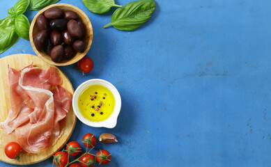 Poster - prosciutto ham on a wooden board with basil