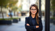 © sema_srinouljan - Young businesswoman wearing glasses in the city looking at the camera