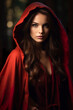 A beautiful witch woman wrapped in a red cloak. Portrait of a witch woman in a magical setting with a cloak of mystery and a touch of drama.