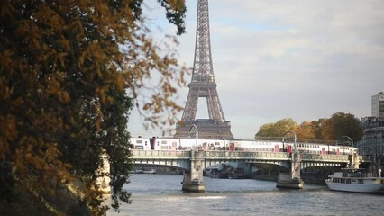 Wall Mural - Scenic view to the Eiffel tower over the river Seine on a nice autumn day in Paris