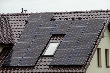 Historic farm house with modern solar panels on roof and wall