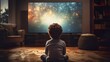 Back view of a little boy sitting in front of tv. Child watching television in dark living room