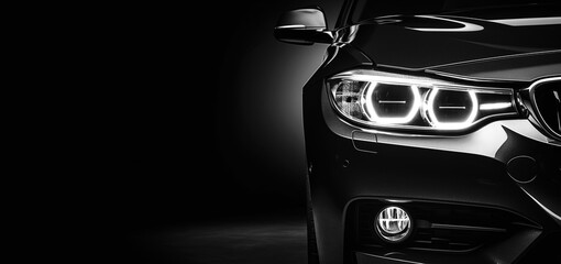 Unbranded generic black sport car isolated on a dark background