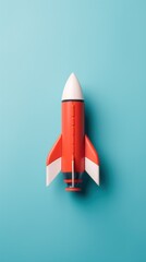 Poster - A red and white toy rocket on a blue background, AI