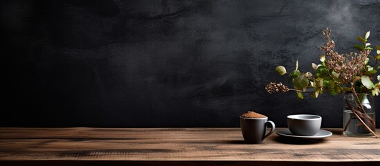 Wall Mural - The black grunge background with its textured wood table creates a cozy and inviting space at the organic cafe where customers can enjoy a delicious breakfast accompanied by a steaming cup o