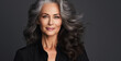Adult woman touch face with smooth healthy skin. Beautiful aging mature woman with long gray hair and happy shy smiling. Beauty and cosmetics skincare advertising concept
