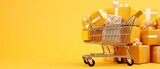Fototapeta  - Shopping cart with gift boxes, isolated on yellow background