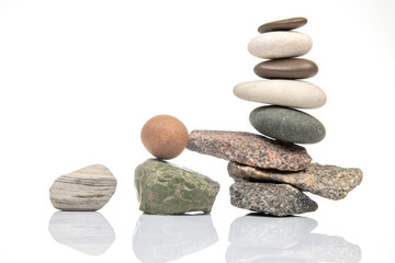 Wall Mural - pyramid of stacked stones on a white background. stabilization and balance in life