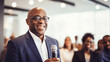 © Tierney - African american businessman giving a speech at conference