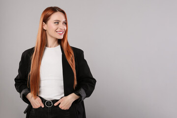 Poster - Portrait of beautiful young woman on light gray background, space for text