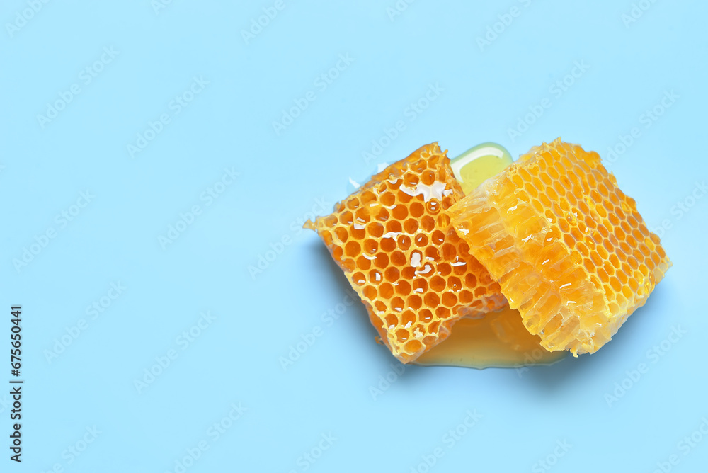 Sweet honeycombs on blue background