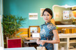 © leungchopan - Woman wear traditional chinese cheongsam in the vintage restaurant