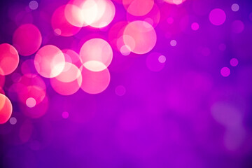 Wall Mural - pink bokeh on purple background with copy space