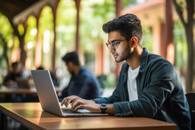 College Student Using Laptop At Library