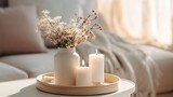 Flowers in vase and burning candles in living room, cosy winter interior home decor, calm and relax living mockup arrangement
