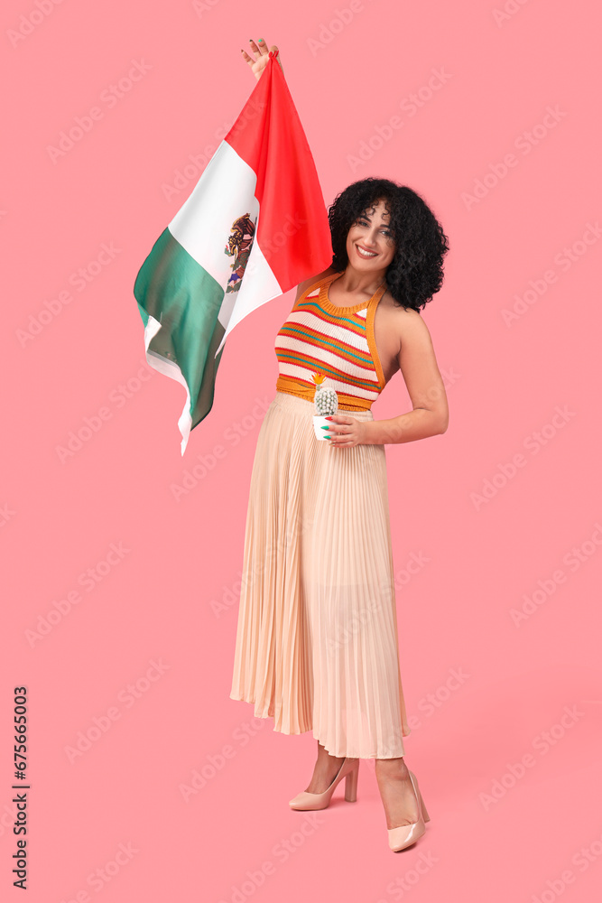 Beautiful woman with Mexican flag on pink background