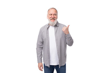 Wall Mural - handsome retired man with a beard and a big mustache is dressed in a shirt and jeans