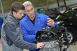 © auremar - student with instructor repairing a car during apprenticeship
