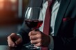 business man hands holding a red wine glass .generative ai