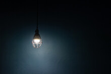 Light Bulb Warm Light Shade On Dark Background, Concept Of Creativity And Innovation.