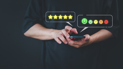 Fototapete - Customer use a smartphone give point 5 stars and smile face icon for feedback review satisfaction service opinion and testimonial on application. Online customer review satisfaction feedback survey.