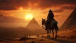 © sirisakboakaew - ourist man with hat riding on camel background pyramid of Egyptian Giza, sunset Cairo,