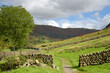 Dry stone wall across footpath in the Great Langdale Valley in the Lake District
