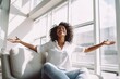 Happy afro american woman relaxing on the sofa at home. Smiling girl enjoying day off lying on the couch. Healthy life style, good vibes people and new home concept.