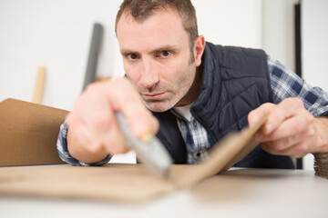 a man is assembling a box