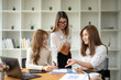 © Wasana - Business team worker consult and plan together. Brainstorm, share, and discuss business project ideas.