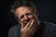 © Andrii  - Ache and Agony: Middle-Aged Man's Dental Distress