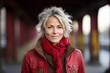 © Nerea - Portrait of a beautiful middle-aged woman in a red jacket