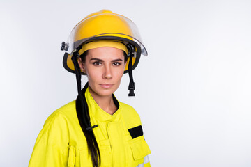 Sticker - Photo of strong confident young fire lady workwear yellow helmet empty space isolated white color background