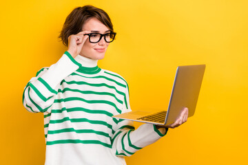 Poster - Photo of positive smart lady wear striped pullover spectacles texting modern gadget isolated yellow color background