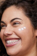 © Cultura Creative - Close-up of young woman applying face cream