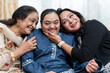 © Cultura Creative - Family portrait with down syndrome woman at home