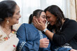 © Cultura Creative - Family portrait with down syndrome woman at home