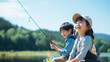 日本の７歳の兄と５歳の妹が楽しそうに釣りをしています。A 7-year-old brother and 5-year-old sister in Japan are having fun fishing.