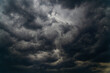 A dark storm cloud closes the sky