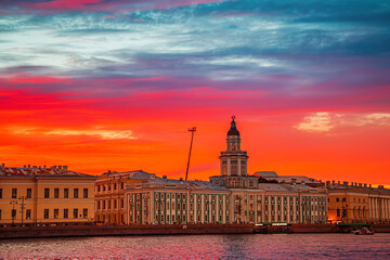 Wall Mural - Fantastic fiery sunset over the Neva River. Kunstkamera building.