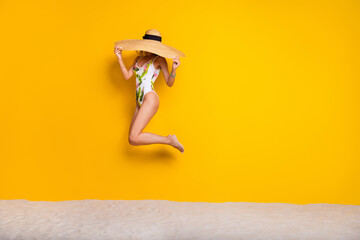 Full length photo of charming cute girl dressed bodysuit straw cap close face jumping high empty space isolated yellow color background