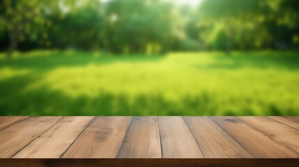 Poster - Wood table top on blurred lawn green background for montage or display your products