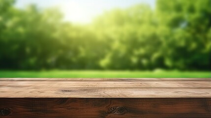 Wall Mural - Wood table top on blurred lawn green background for montage or display your products