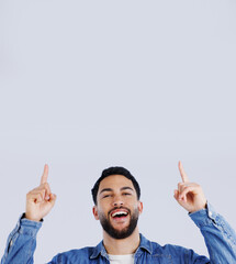 Canvas Print - Man, pointing up and offer in studio with hands to promo, announcement or excited for deal in gray background. Mockup, space or person show choice, decision and gesture to information or opportunity